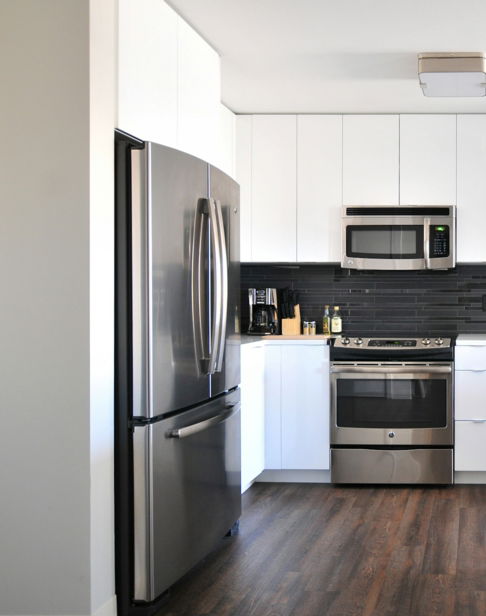 gray-steel-3-door-refrigerator-near-modular-kitchen.jpg gray steel 3-door refrigerator near modular kitchen